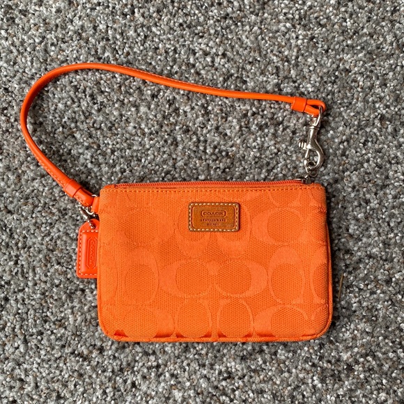 Orange Coach clutch. Like new. Other colors available. - Picture 1 of 3